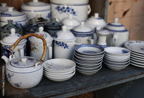 Tabletop display of various blue and white ceramic dishes for sale in Chinatown, San Francisco, USA