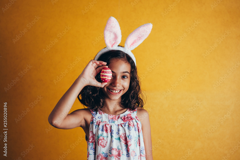 A happy girl showing decorated easter eggs A happy girl showing decorated easter eggs