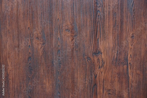 brown wooden background of dry boards in the wall of the fence