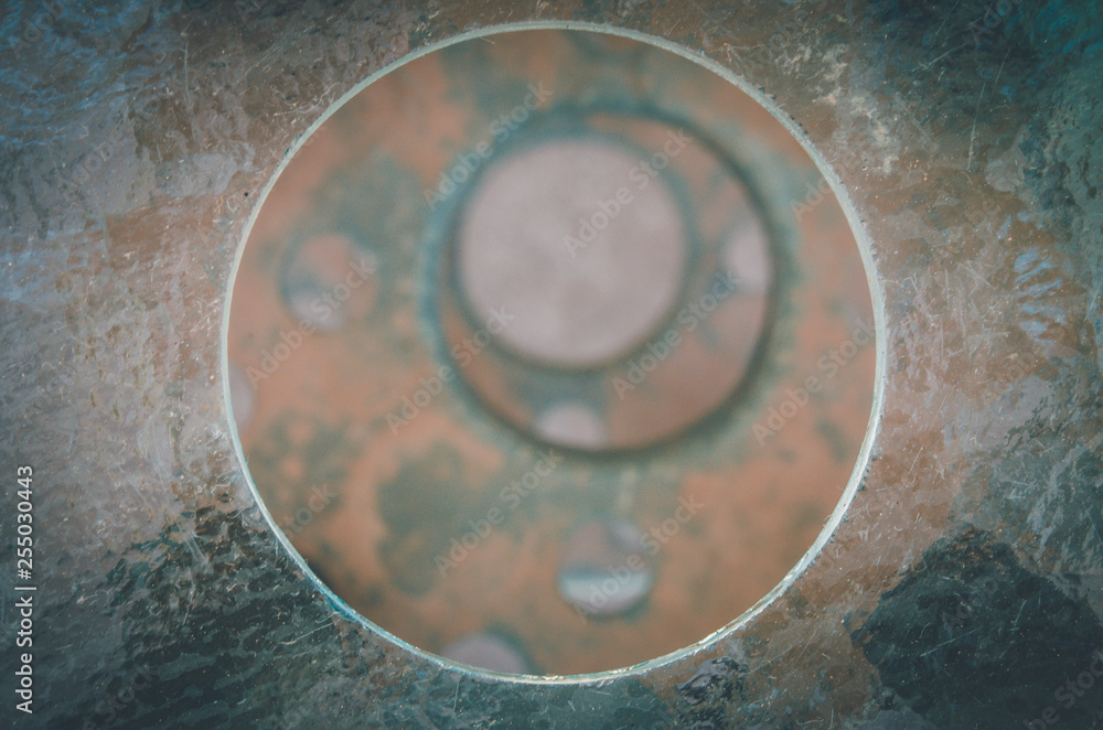 Excentric circles on a pile with rusty metallic texture in San Pedro de Atacama, Chile