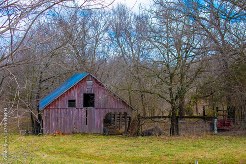 old barn in field