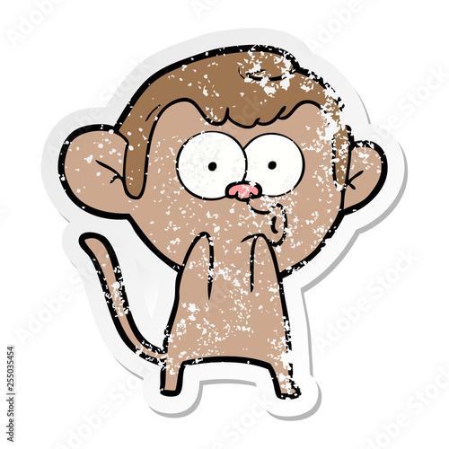 distressed sticker of a cartoon surprised monkey