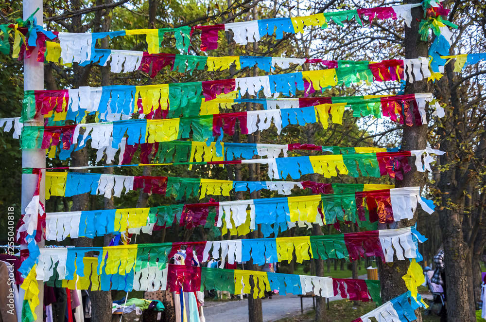 Festive decoration of colorful flags, ribbons