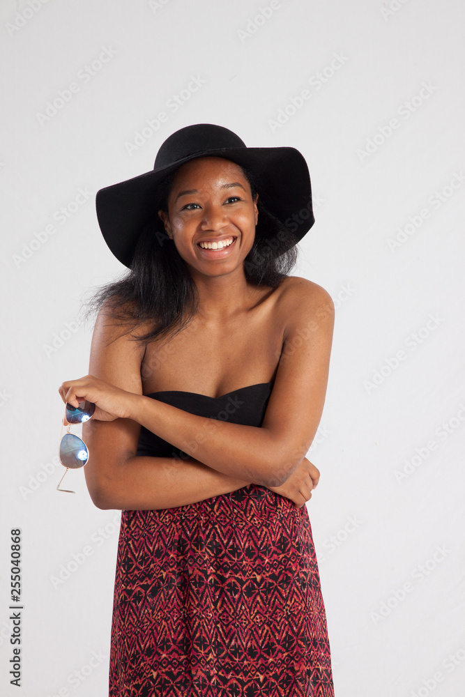 Pretty Black woman with sunglasses and a hat Pretty Black woman with sunglasses and a hat