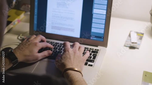 Wallpaper Mural Man typing on a macbook. Torontodigital.ca