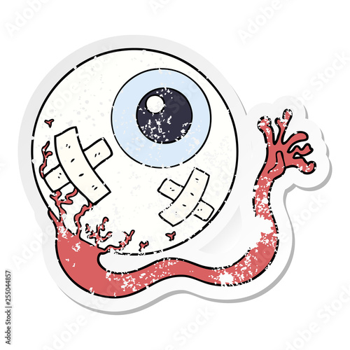 distressed sticker of a cartoon injured eyeball