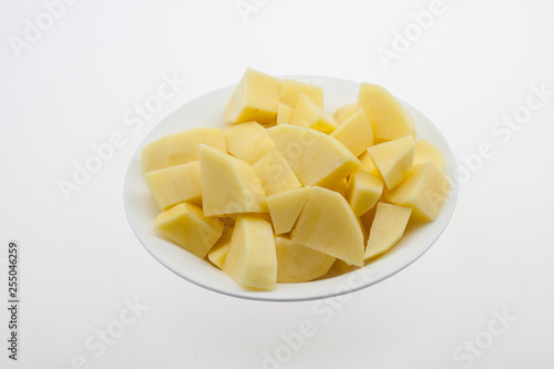 Chopped potato pieces, white plate