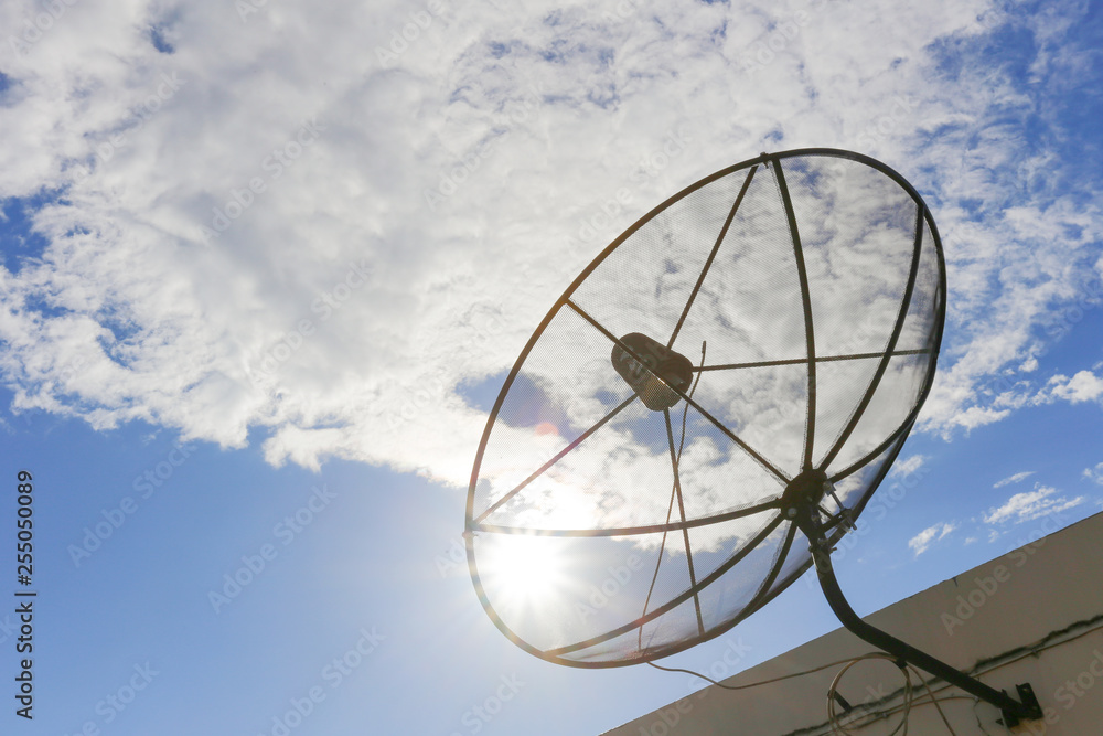 Satellite dish to the sky in blue sky background with tiny clouds