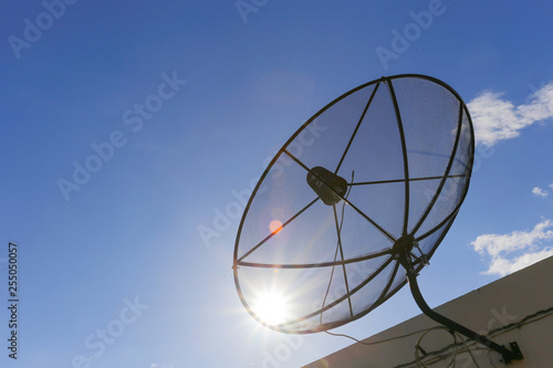 Satellite dish to the sky in blue sky background with tiny clouds