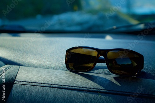 Sunglasses on a Car Dash