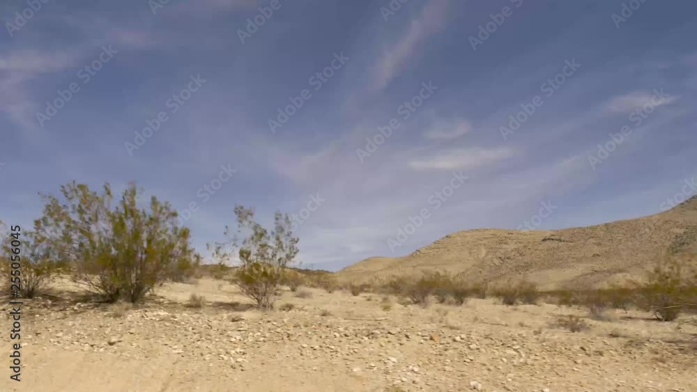 Driving past Nevada desert hills on US Highway 93 the Great Basin Highway-Drive Plate-POV-Side view Driving past Nevada desert hills on US Highway 93 the Great Basin Highway-Drive Plate-POV-Side view