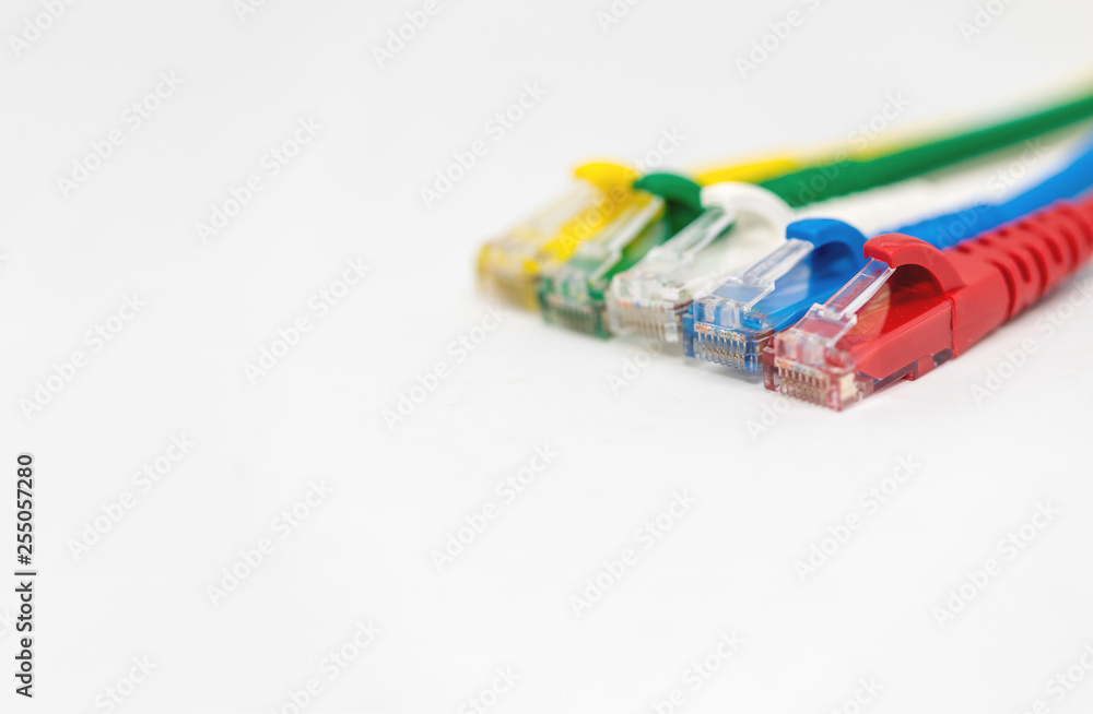 Close up multi coloured ethernet network cables isolate on white background,Bunch of multicolored RJ45 cables,Spot focus. Close up multi coloured ethernet network cables isolate on white background,Bunch of multicolored RJ45 cables,Spot focus.