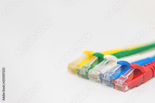 Close up multi coloured ethernet network cables isolate on white background,Bunch of multicolored RJ45 cables,Spot focus.