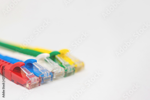 Close up multi coloured ethernet network cables isolate on white background,Bunch of multicolored RJ45 cables,Spot focus.