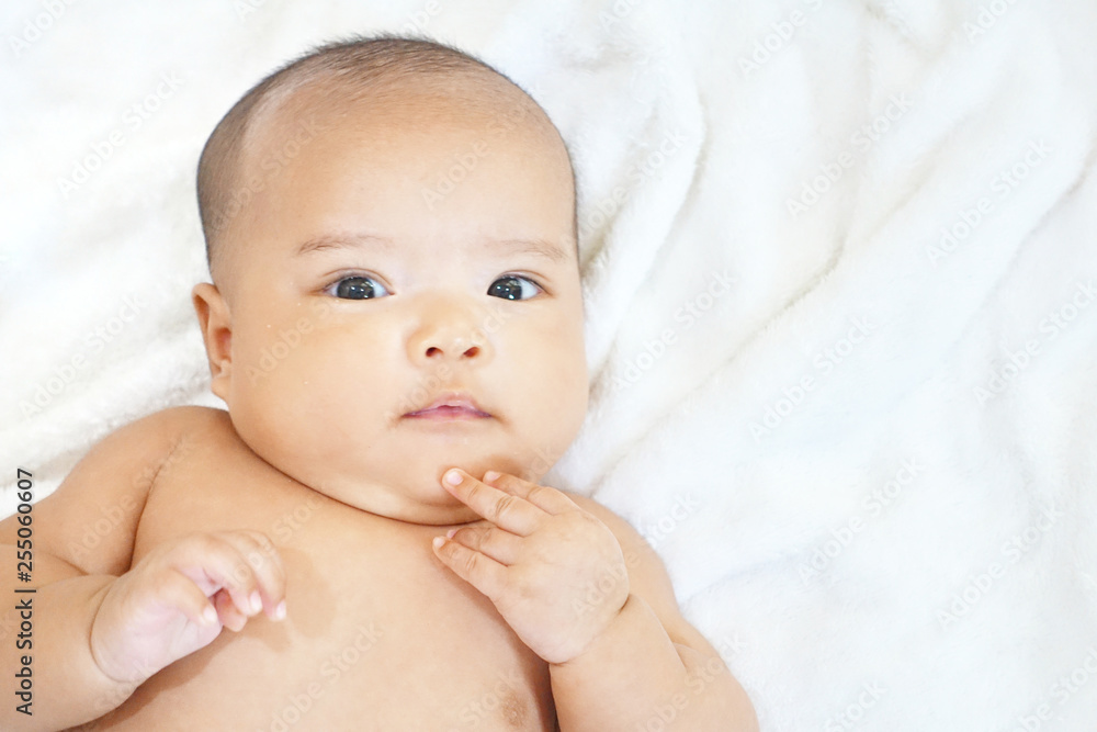 Newborn baby girl on white towel after done shower Newborn baby girl on white towel after done shower