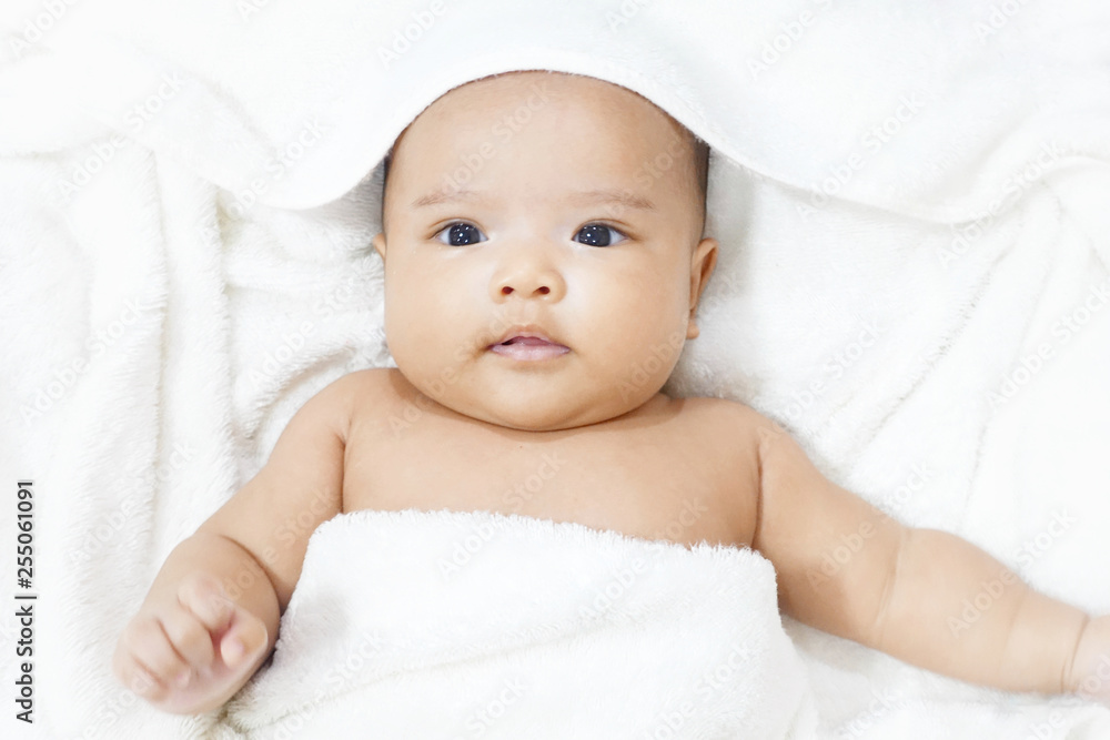 Newborn baby girl on white towel after done shower Newborn baby girl on white towel after done shower