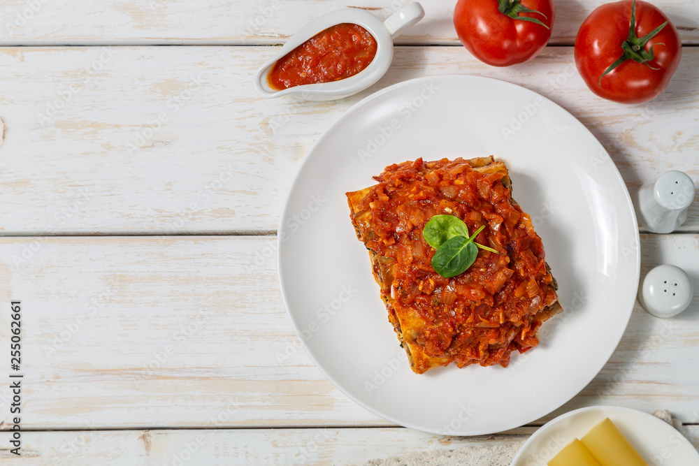 Cannelloni with ground beef baked in tomato sauce. The view from the top. Copy-space. Cannelloni with ground beef baked in tomato sauce. The view from the top. Copy-space.