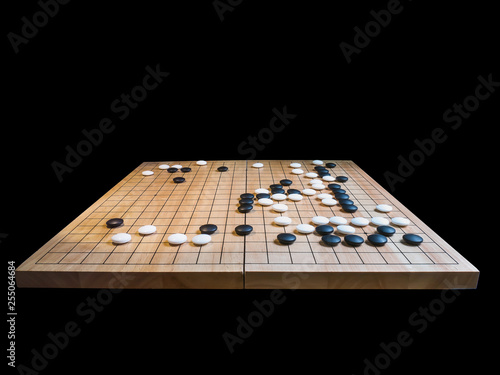 group of stones,Go game(Weiqi),Traditional asian strategy board game isolated on black background