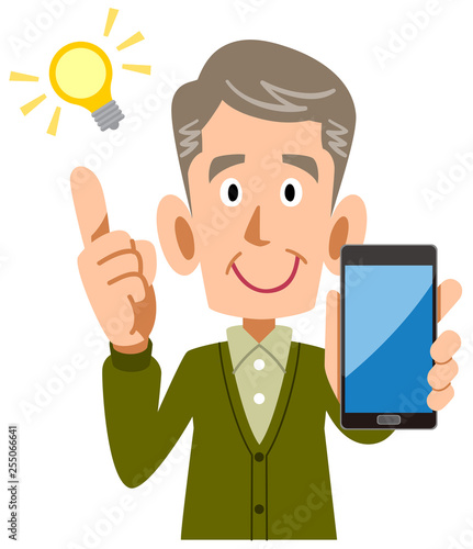 スマートフォンを手に持ち閃くシニアの男性