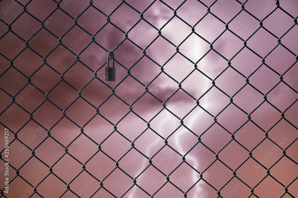 Fototapeta premium Conceptual image of lightning in the stormy sky and steel mesh wire fence. Concept of hope and freedom