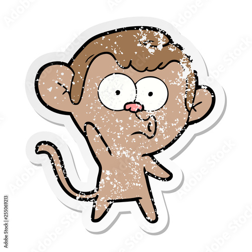 distressed sticker of a cartoon hooting monkey