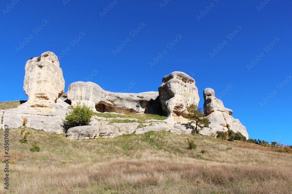 View of the Stone Sphinxes. This natural mountain range is located right near the old part of the city of Bakhchisarai on the Crimean peninsula. Some of this rocks looks like faces.