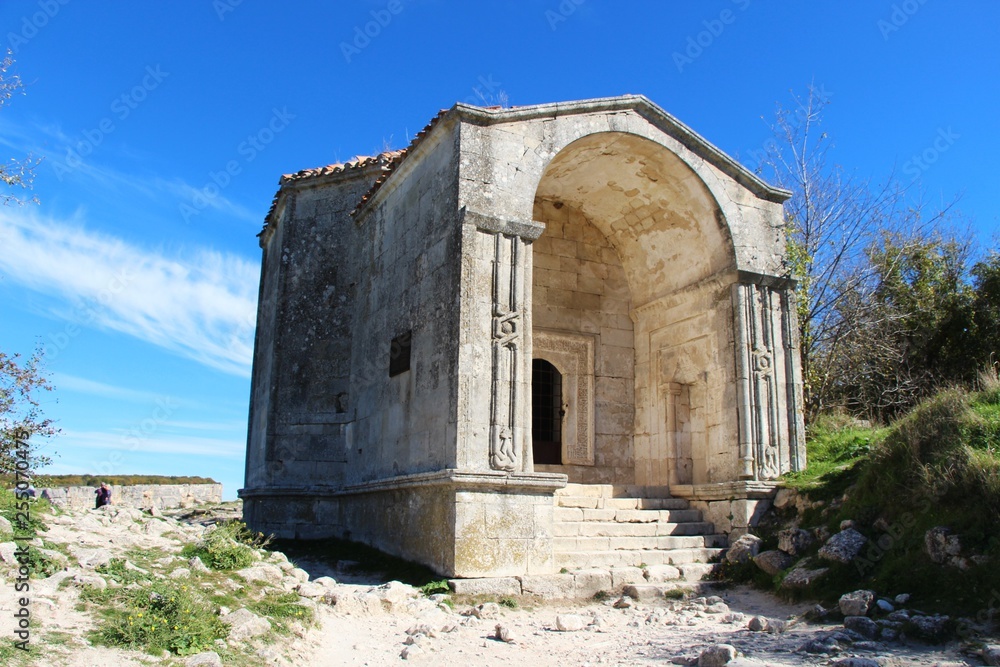 View of Mausoleum of Dzhanike-Khanym, daughter of Tokhtamysh, in the cave city of Chufut-Kale. Chufut-Kale is a medieval city-fortress in the Crimean Mountains that now lies in ruins.