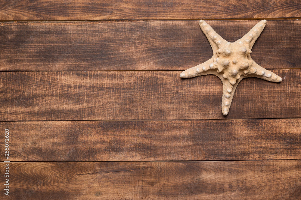 Summer background, starfish on wooden boards. Summer background, starfish on wooden boards.
