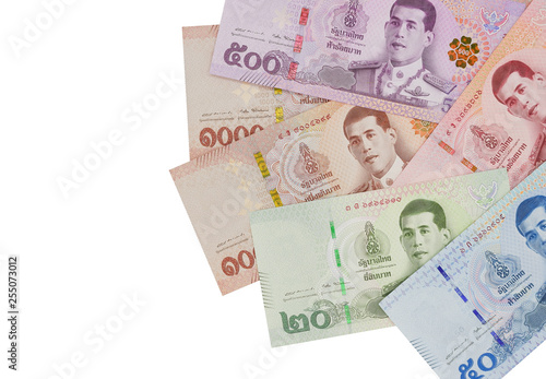 Pile of new Thai Baht banknotes, isolated on white background. Business and finance concept.