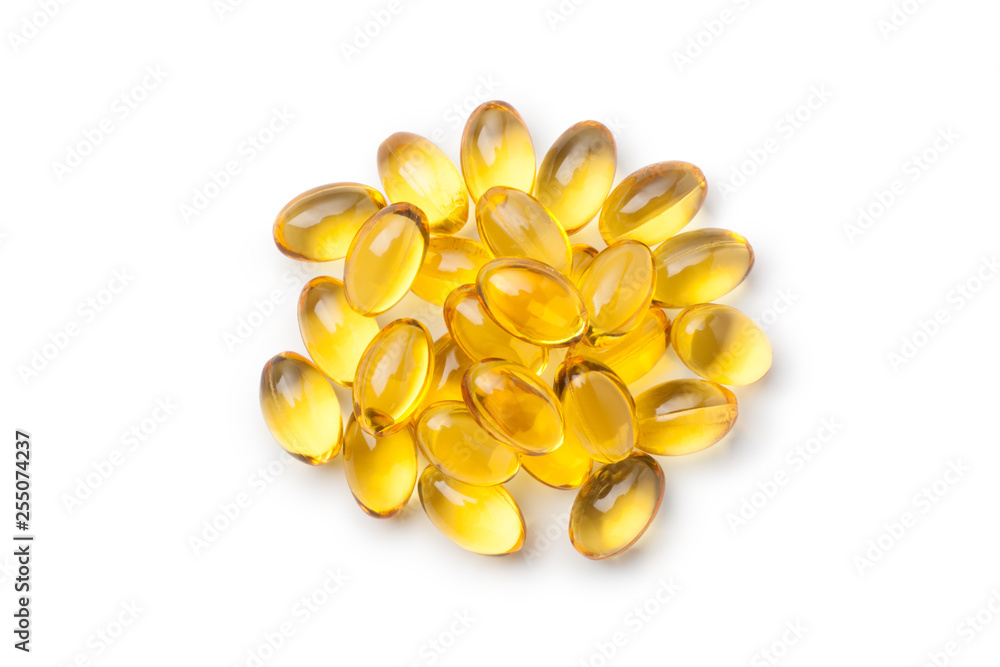 Pile of fish oil capsules isolated on white background. Top view. Pile of fish oil capsules isolated on white background. Top view.