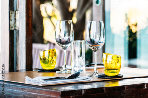 Wine glass with dining set prepare for breakfast lunch or dinner on table in restaurant