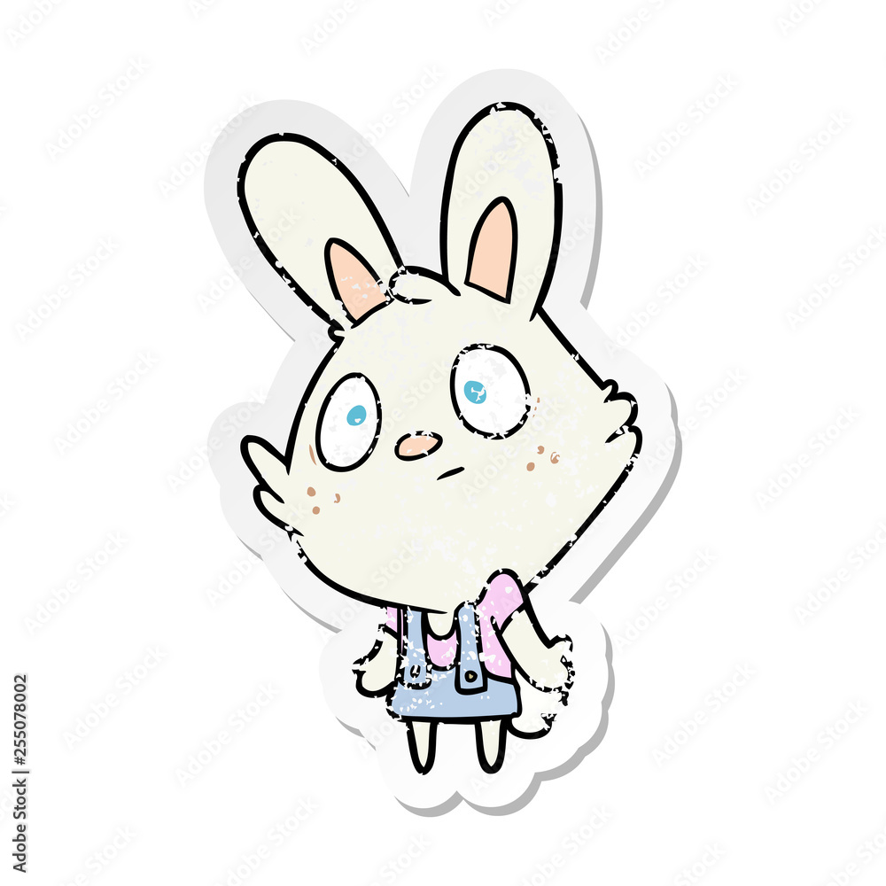 distressed sticker of a cartoon rabbit shrugging shoulders
