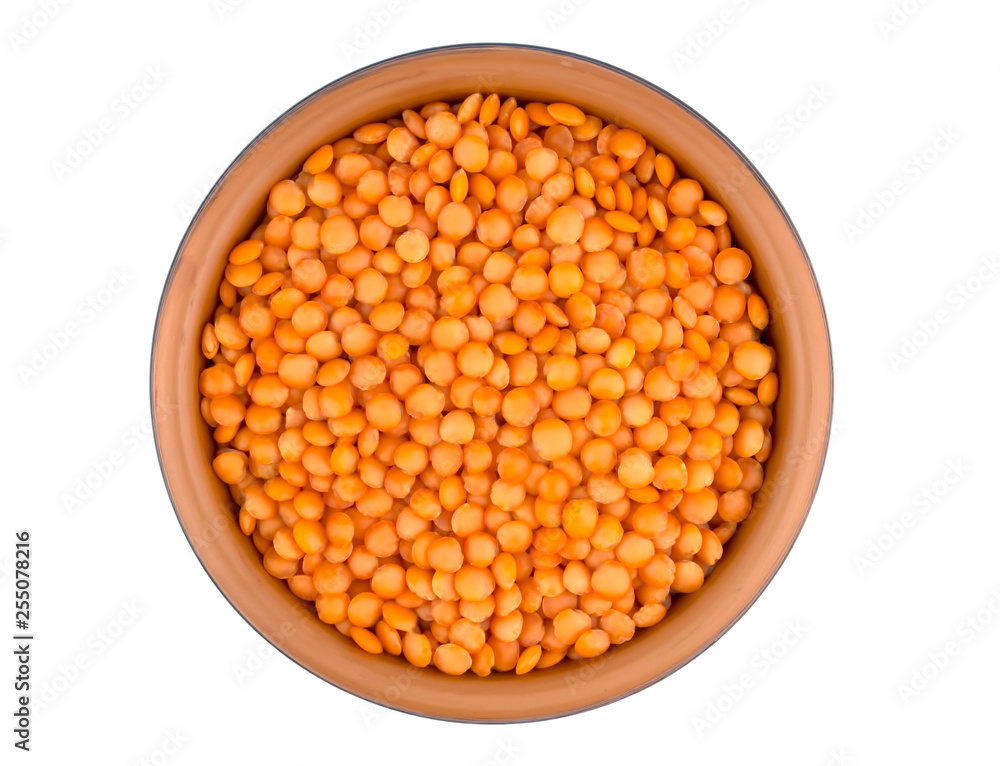 Red lentils in plate isolated on white background Red lentils in plate isolated on white background