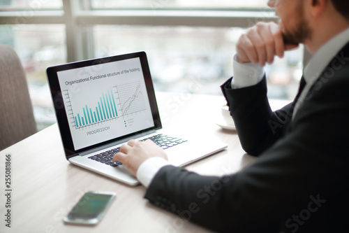 businessman working with financial charts on the laptop.