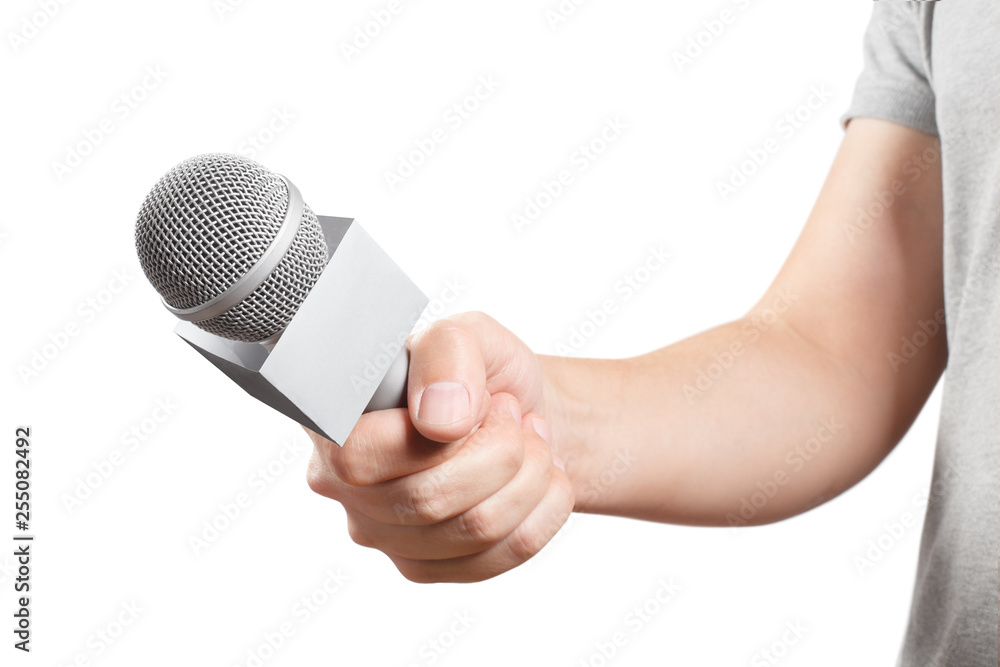 Hand of the news reporter holding a microphone, isolated on white  background Stock Photo | Adobe Stock