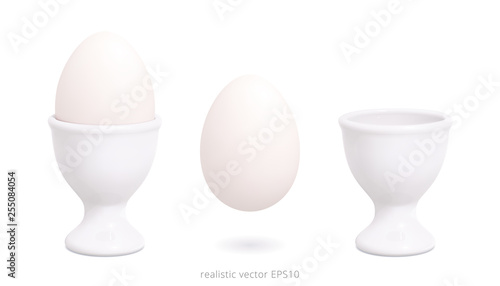 White porcelain or plastic egg cups. 3d realistic vector design of holder with a gradient mesh. Boiled blank chicken egg floats over white background. Empty template. White mock up. Detailed clipart