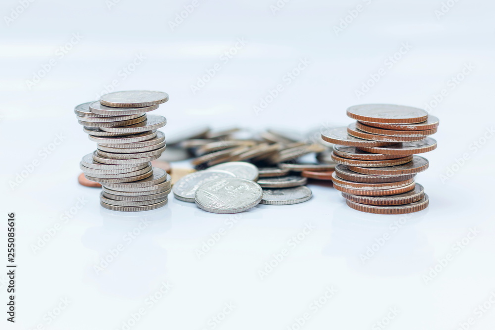 The concept of saving money set up on a white background. The concept of saving money set up on a white background.