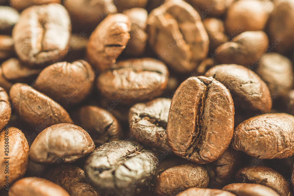 Roasted coffee beans closeup background Roasted coffee beans closeup background