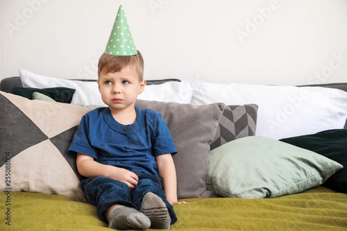 Sad little boy celebrating ...