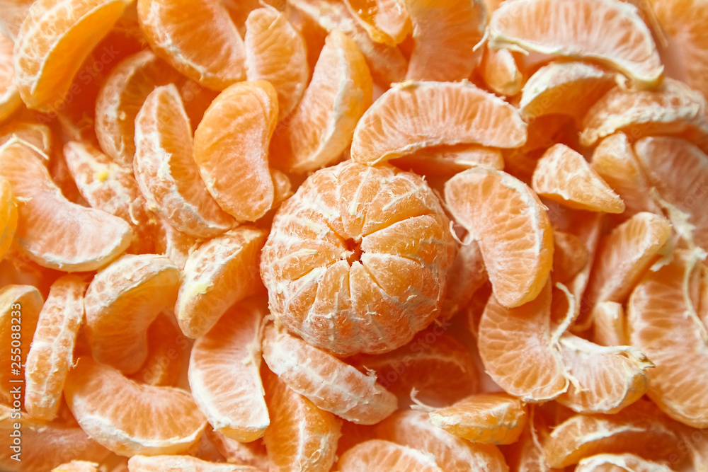 Peeled tangerine. Segments of mandarin fruit background Peeled tangerine. Segments of mandarin fruit background
