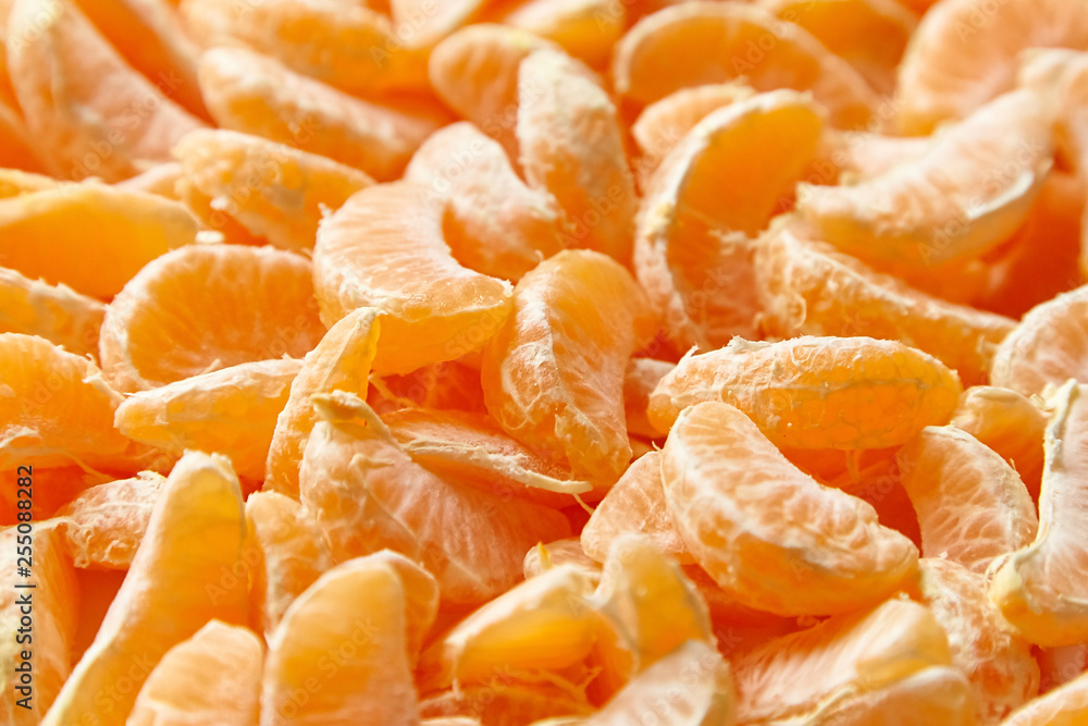 Peeled tangerine. Segments of mandarin fruit background Peeled tangerine. Segments of mandarin fruit background