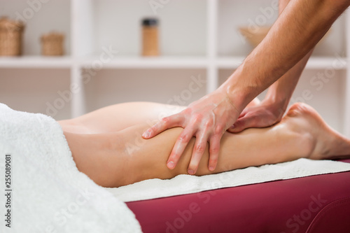 Young woman is enjoying massage on spa treatment. 