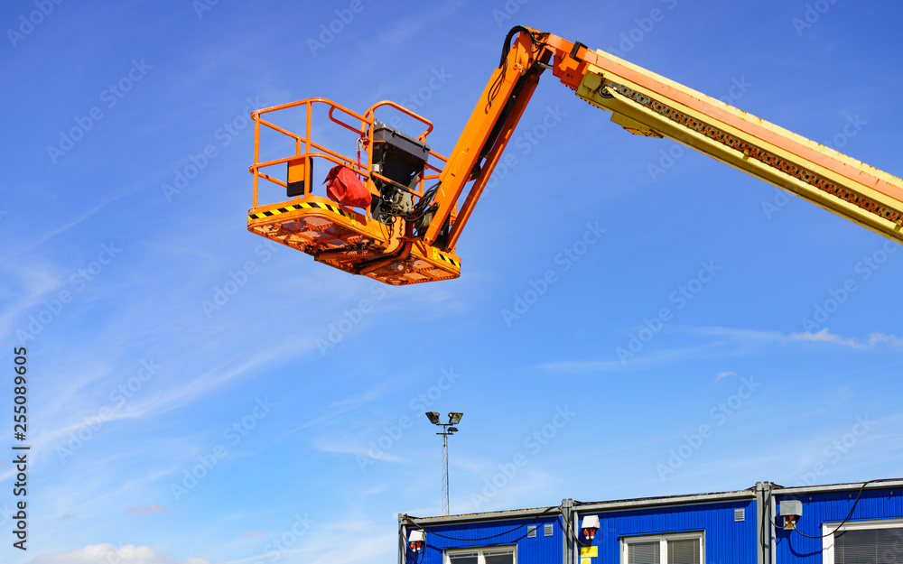 Basket lift on construction site Basket lift on construction site