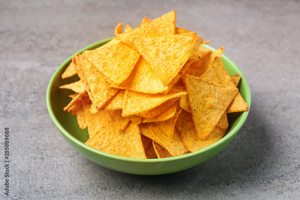Plate with tasty nachos on table Plate with tasty nachos on table
