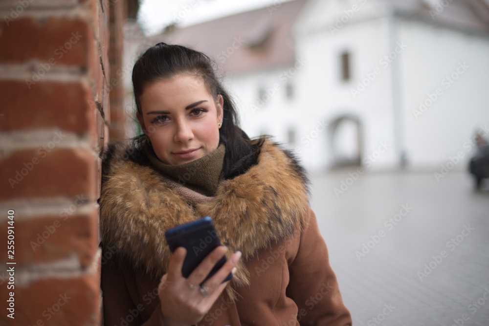 girl with phone in the city.
