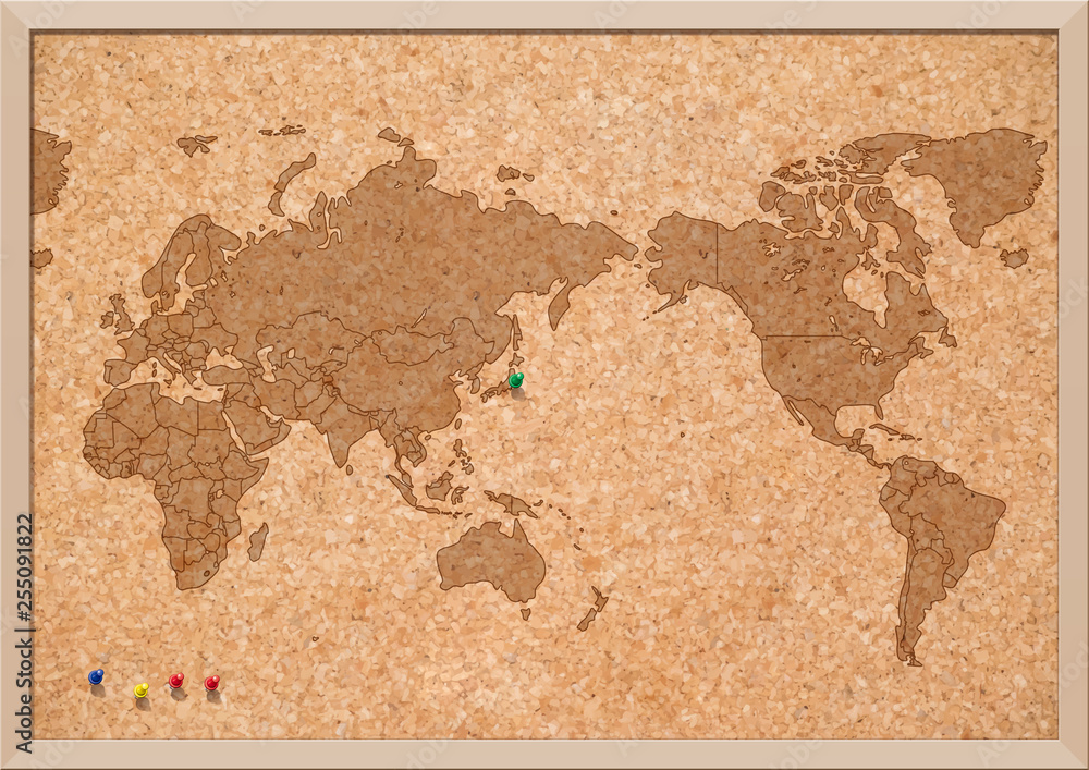 コルクボードの世界地図と押しピン