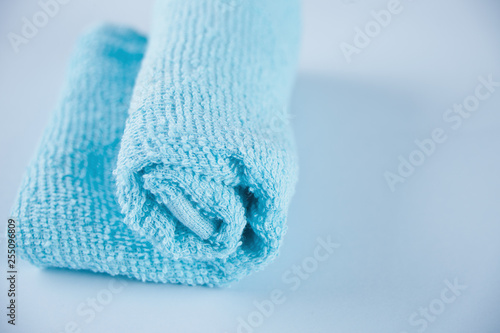 Blue towel spa cloth beach towel on blue background.