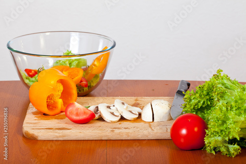 Women's hands are preparing a salad