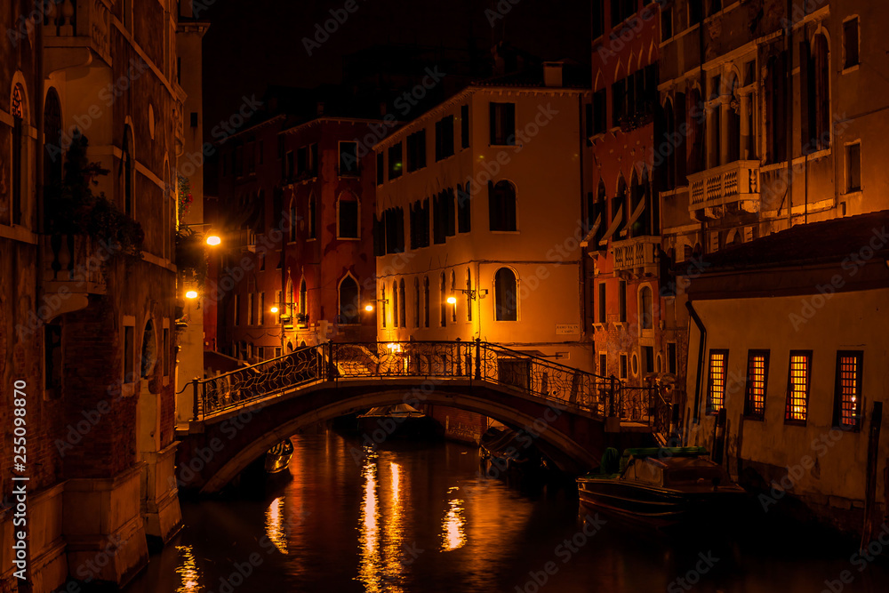 Long exposure. View of the bridge over canal in Venice, Italy, at night.