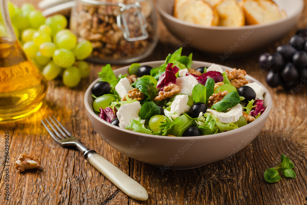 Italian spring salad with goat cheese, grapes and walnuts. Served with croutons. Italian spring salad with goat cheese, grapes and walnuts. Served with croutons.